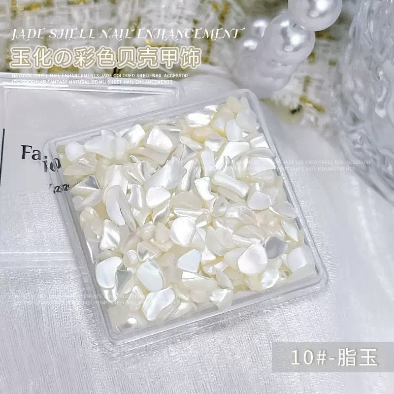 A box of jade-finished shell nail charm