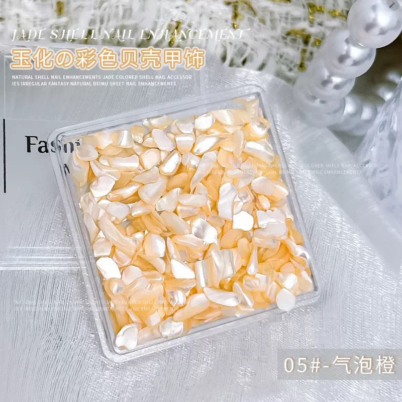 A box of jade-finished shell nail charm