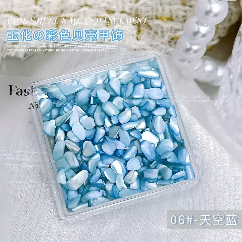 A box of jade-finished shell nail charm